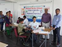 Personnel from Indian Red Cross Society taking blood sample for Thalassemia test